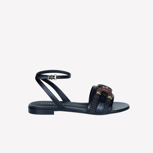 SANDAL FLAT IN BLACK APATAKI WITH WOOD ACCESSORY AND ANKLE STRAP ELVAS - Products | Roberto Festa